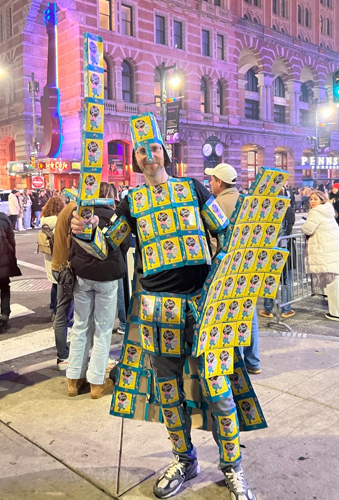 Shawn as Sweet Knight standing in a holiday parade